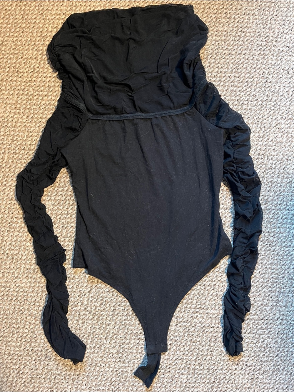 Black bodysuit with mesh sleeves and collar